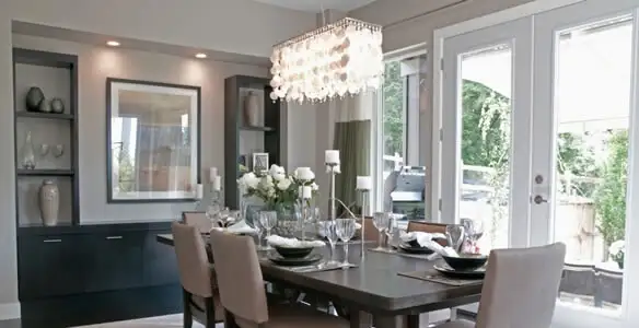 Elegant dining room chandelier installation above table in Spokane, WA