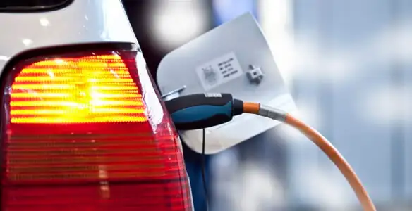 Electric car plugged into EV charger after professional installation in Spokane, WA