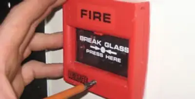 fire alarm installation service showing manual fire alarm pull station installed by licensed electricians in Spokane, WA