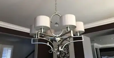 Modern chandelier installation with multiple light fixtures in Spokane, WA