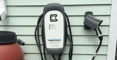 Outdoor electric vehicle charger installation on residential wall in Spokane, WA