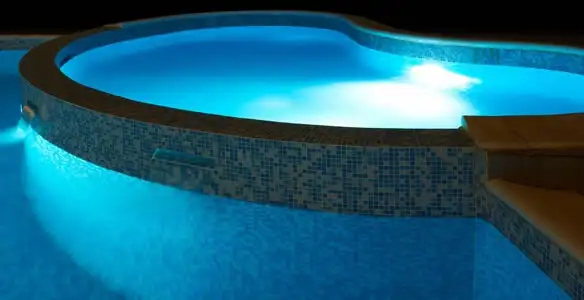 pool light installation and repair services highlighting illuminated pool interior lighting in Spokane, WA